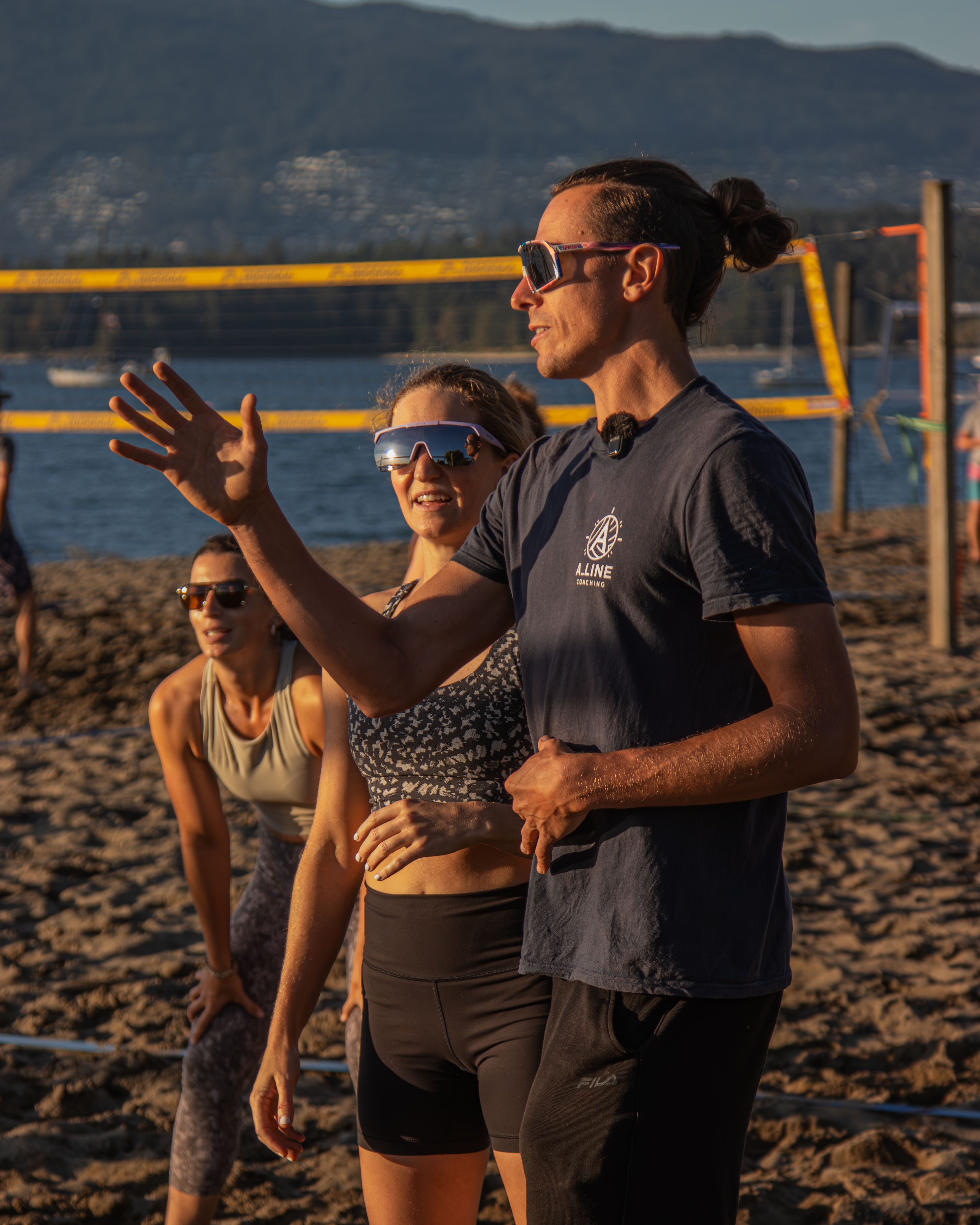 Adam Thompson coaching beach volleyball at sunset, Kits Beach
